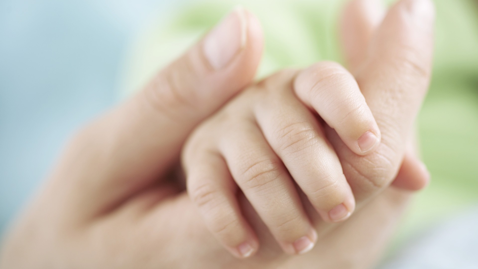 Mohter-Holding-Baby-Hand
